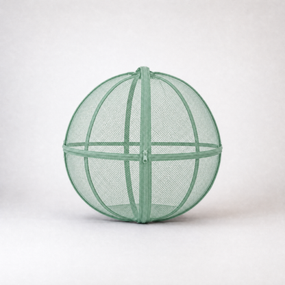Green rounded mesh cat playpen with a zippered opening